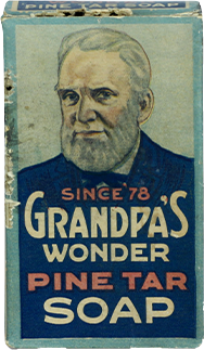 Vintage box of Grandpas Wonder Pine Tar Soap featuring an illustrated older man with a beard on the front. Text reads Since 78 Grandpas Wonder Pine Tar Soap on a blue and teal background.