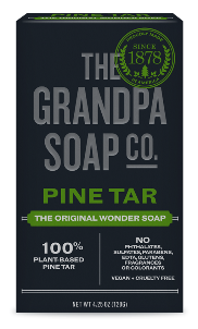 A box of The Grandpa Soap Co. Pine Tar soap. The packaging is dark with green and white text, stating it is 100% plant-based pine tar, vegan, cruelty free, and free of artificial ingredients.