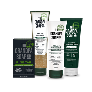 The Pine Tar Collection Bundle from Grandpa Soap Co., featuring body wash, shampoo, conditioner, and bar soap in green and white packaging, displayed on a plain white background.